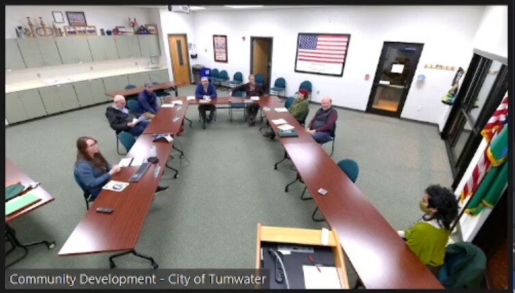 Evergreen State College student Amita Devarajan (lower right) presents her study to the Tumwater Tree Board.